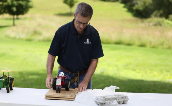 Jim Carrabba uses Mr. GoodEgg to demonstrate the dangers of tractors not equipped with a ROPS structure